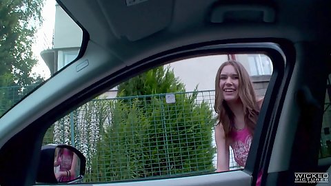 Playful skinny college teen Nadia Bella jumps in car and flashes boobs