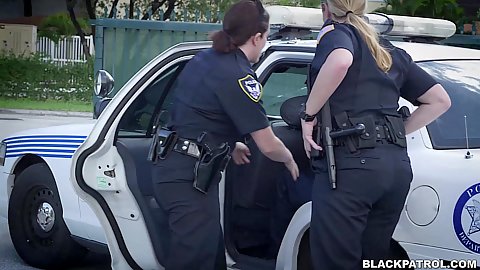 Outdoor street arrest blowjob behind a car and sharing some dick from two uniformed female milf police offiers Joslyn and Maggie Green