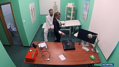 Medical doctors exam room with clothed real estate agent Silvia Dellai entering to get a check up