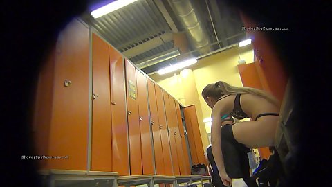 Voyeur spying on milf in bras and panties changing in the locker room with other females