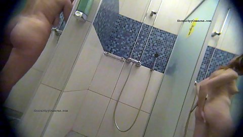 Spy camera in the showers catching women washing and using soap and sponge