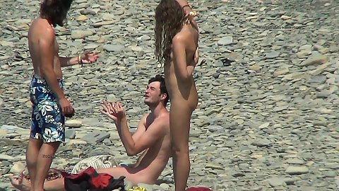 Naked tanned girl and her bf talking with another man while he checks out his naked gf standing there