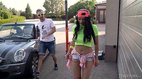 Outdoors on the street we came accross a very happy girl listening to music in tight shorts Ava Black