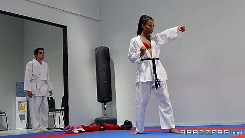 Karate class workout with sporty ebony girl in martial arts uniform Kira Noir giving a footjob with sexy feet