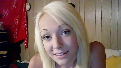 Blonde teenie sitting in front of webcam