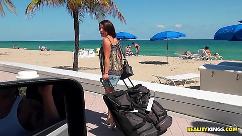Outdoors on the beach with Ryyan with some bags