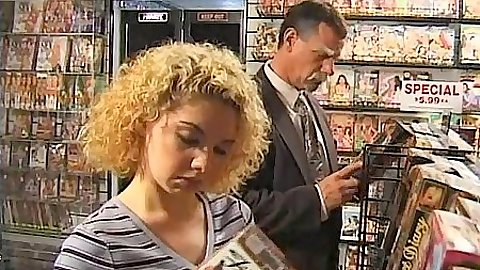 Sex store with Kiki Daire sucking some dick in the back