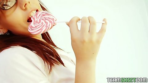 Kacie James licking her popsicle and undressing from cute teen outfit