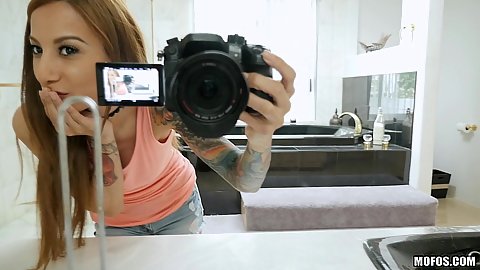 Stassi Sinclair making a selfie with a mirror stripping