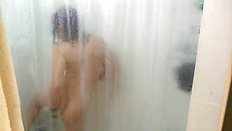Chick is washing her pussy and ass in the shower