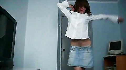 Cute teen is doing a happy dorm room dance strip