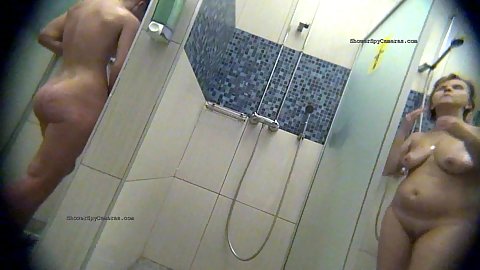 Women coming up one by one getting undressed and using soap to clean themselves off in the shower for hidden camera