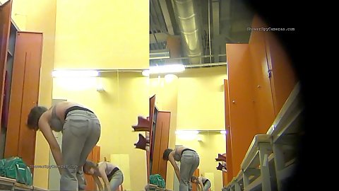 Newly installed hidden camera in the womens changing room showing naked slim and fat ass women getting changed