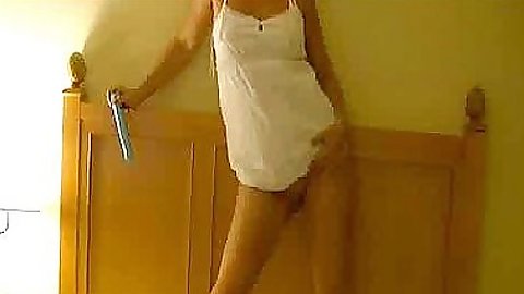 Cute babe goes up her dress with dildo on home cam